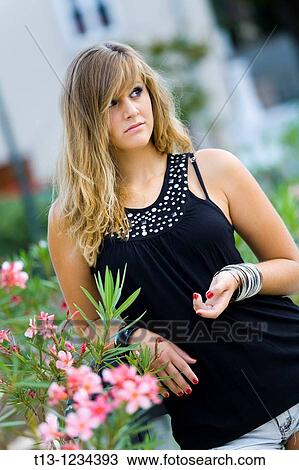Pretty girl and pink flowers View Large Photo Image Stock Image - Pretty girl and pink flowers. Fotosearch