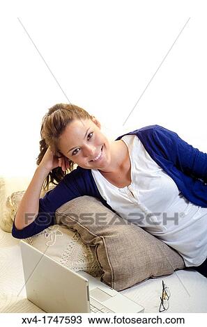 Pretty girl chatting on notebook in the bedroom View Large Photo Image Stock Image - Pretty girl chatting on notebook in the bedroom. Fotosearch