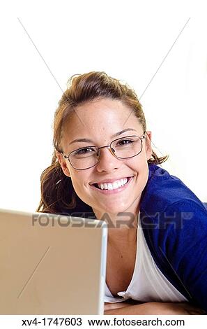 Pretty girl chatting on notebook in the bedroom View Large Photo Image Stock Image - Pretty girl chatting on notebook in the bedroom. Fotosearch