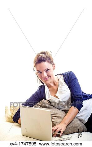 Pretty girl chatting on notebook in the bedroom View Large Photo Image Stock Photography - Pretty girl chatting on notebook in the bedroom. Fotosearch
