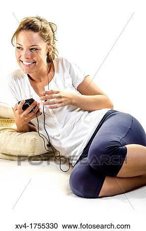 Pretty girl listening music in the bedroom View Large Photo Image Stock Image - Pretty girl listening music in the bedroom. Fotosearch
