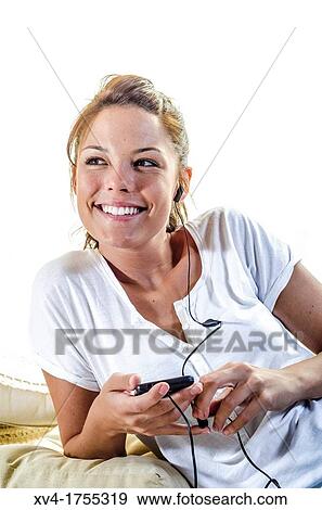 Pretty girl listening music in the bedroom View Large Photo Image Stock Photo - Pretty girl listening music in the bedroom. Fotosearch