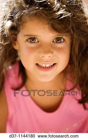 Pretty girl looking at the camera View Large Photo Image Stock Image - Pretty girl looking at the camera. Fotosearch