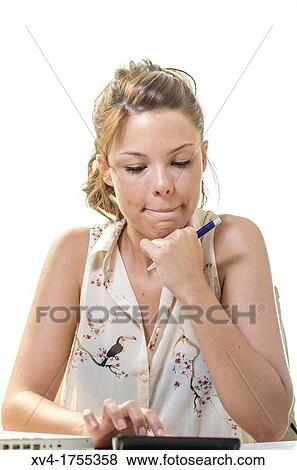Stock Photo - Pretty girl making homework. Fotosearch