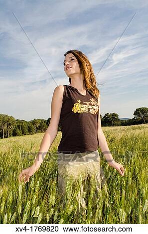 Pretty girl relaxing and enjoy in the wheat field View Large Photo Image Stock Image - Pretty girl relaxing and enjoy in the wheat field. Fotosearch