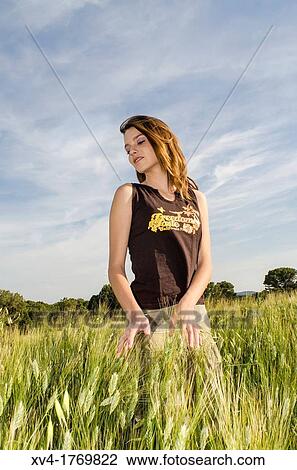 Pretty girl relaxing and enjoy in the wheat field View Large Photo Image Stock Image - Pretty girl relaxing and enjoy in the wheat field. Fotosearch