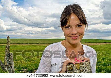 Pretty girl relaxing in the ruralscape and look at camera, Aragon, Spain View Large Photo Image Stock Image - Pretty girl relaxing in the ruralscape and look at camera, Aragon, Spain. Fotosearch