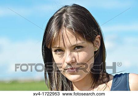 Stock Image - Pretty girl relaxing in the ruralscape and look at camera, Aragon, Spain. Fotosearch