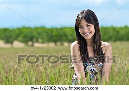 Pretty girl relaxing in the ruralscape and look at camera, Aragon, Spain View Large Photo Image Stock Image - Pretty girl relaxing in the ruralscape and look at camera, Aragon, Spain. Fotosearch