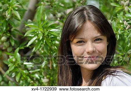 Pretty girl relaxing in the ruralscape and look at camera, Aragon, Spain View Large Photo Image Stock Photo - Pretty girl relaxing in the ruralscape and look at camera, Aragon, Spain. Fotosearch