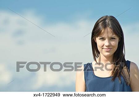 Pretty girl relaxing in the ruralscape and look at camera, Aragon, Spain View Large Photo Image Stock Photo - Pretty girl relaxing in the ruralscape and look at camera, Aragon, Spain. Fotosearch