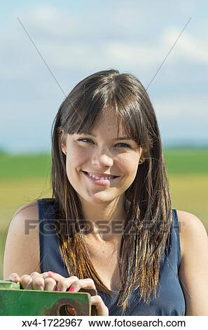 Pretty girl relaxing in the ruralscape and look at camera, Aragon, Spain View Large Photo Image Stock Photo - Pretty girl relaxing in the ruralscape and look at camera, Aragon, Spain. Fotosearch