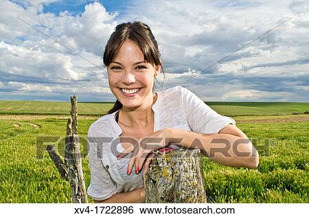 Pretty girl relaxing in the ruralscape and look at camera, Aragon, Spain View Large Photo Image Stock Photograph - Pretty girl relaxing in the ruralscape and look at camera, Aragon, Spain. Fotosearch