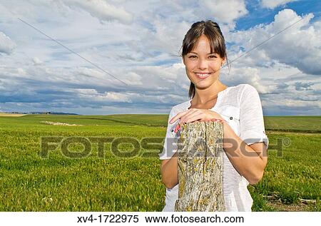 Pretty girl relaxing in the ruralscape and look at camera, Aragon, Spain View Large Photo Image Stock Photography - Pretty girl relaxing in the ruralscape and look at camera, Aragon, Spain. Fotosearch