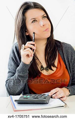 Pretty girl take notes and calculator tasks View Large Photo Image Stock Image - Pretty girl take notes and calculator tasks. Fotosearch