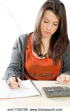 Pretty girl take notes and calculator tasks View Large Photo Image Stock Photo - Pretty girl take notes and calculator tasks. Fotosearch