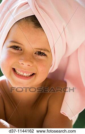 Pretty girl with a towel around her head View Large Photo Image Stock Image - Pretty girl with a towel around her head. Fotosearch