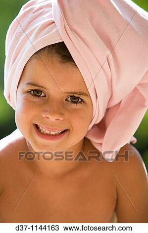 Pretty girl with a towel around her head View Large Photo Image Stock Image - Pretty girl with a towel around her head. Fotosearch