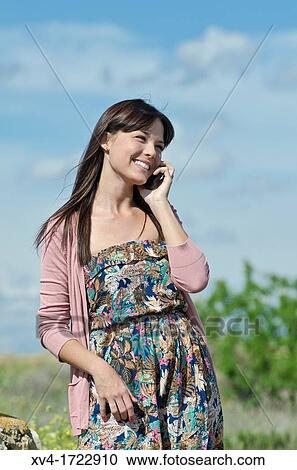 Pretty girl with cell phone in outdoors View Large Photo Image Stock Image - Pretty girl with cell phone in outdoors. Fotosearch