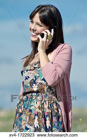 Pretty girl with cell phone in outdoors View Large Photo Image Stock Image - Pretty girl with cell phone in outdoors. Fotosearch