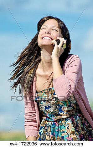 Pretty girl with cell phone in outdoors View Large Photo Image Stock Photograph - Pretty girl with cell phone in outdoors. Fotosearch