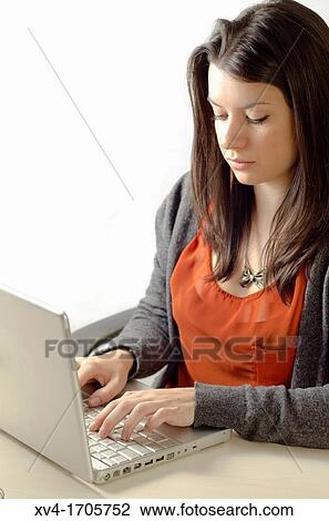 Stock Image - Pretty girl working with notebook. Fotosearch