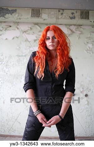 Stock Image - pretty redhead girl in ruins. Fotosearch