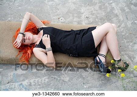 Stock Image - pretty redhead girl lying. Fotosearch