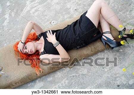 Stock Image - pretty redhead girl lying. Fotosearch