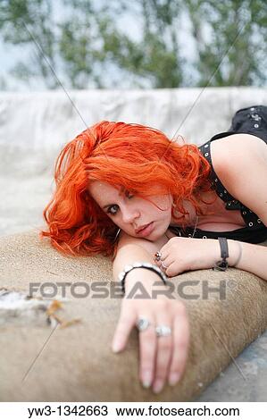 Stock Image - pretty redhead girl lying. Fotosearch