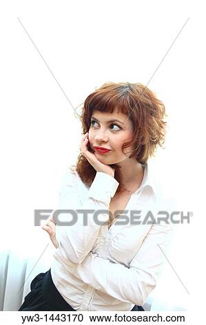 Stock Image - Pretty redhead young woman portrait indoors. Fotosearch