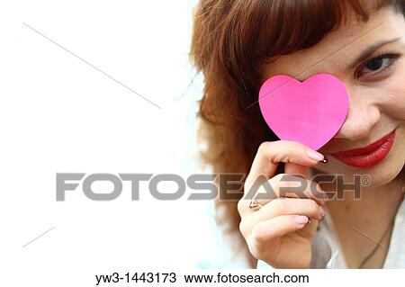 Pretty redhead young woman portrait with heart indoors View Large Photo Image Stock Image - Pretty redhead young woman portrait with heart indoors. Fotosearch