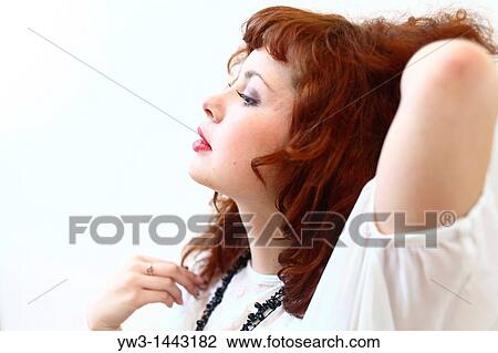 Pretty redhead young woman portrait indoors View Large Photo Image Stock Image - Pretty redhead young woman portrait indoors. Fotosearch