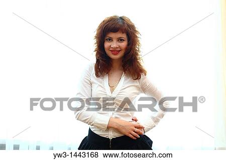 Pretty redhead young woman portrait indoors View Large Photo Image Stock Photo - Pretty redhead young woman portrait indoors. Fotosearch