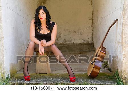 Pretty woman and a guitar View Large Photo Image Stock Image - Pretty woman and a guitar. Fotosearch