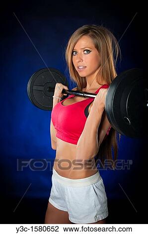 Pretty woman at fitness training with workout bar View Large Photo Image Stock Image - Pretty woman at fitness training with workout bar. Fotosearch