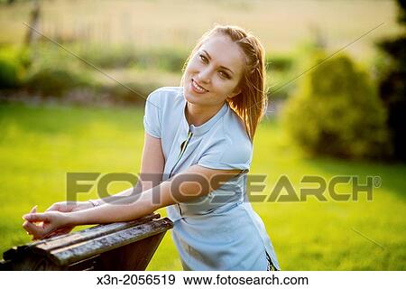 Stock Photo - Pretty woman outdoors in springtime.. Fotosearch