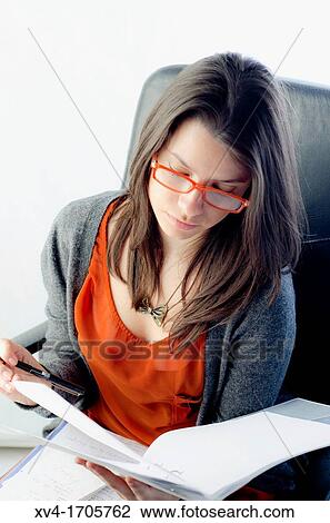 Pretty woman working at company View Large Photo Image Stock Image - Pretty woman working at company. Fotosearch