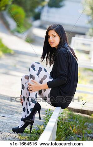 Pretty young woman in the park View Large Photo Image Stock Photograph - Pretty young woman in the park. Fotosearch
