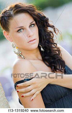 Pretty young woman is exposing shoulder View Large Photo Image Stock Image - Pretty young woman is exposing shoulder. Fotosearch