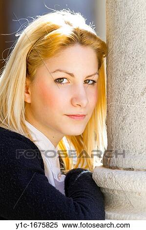 Stock Photography - Pretty young woman portrait backlit. Fotosearch