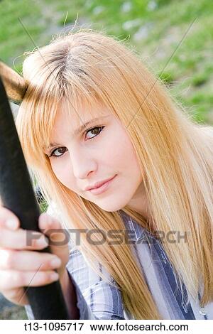 Pretty young woman portrait in the park View Large Photo Image Stock Photo - Pretty young woman portrait in the park. Fotosearch