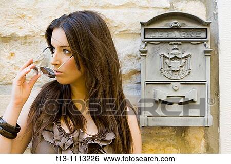 Pretty young woman portrait next to an old-fashioned postal box reading? LETTERE? on it View Large Photo Image Stock Photograph - Pretty young woman portrait next to an old-fashioned postal box reading? LETTERE? on it. Fotosearch