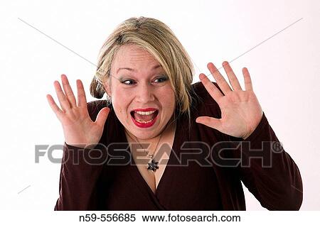 Stock Photography - Pretty young woman with shocked exression and body language.. Fotosearch