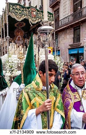 priest, altar server and penitent in procession, sisterhood of Jess del Gran Poder y virgen de la Macarena, (Statue usually in the San Agustin church), Good Friday, Easter week, carrer Hospital, Barcelona, Catalonia, Spain. View Large Photo Image Stock Photo - priest, altar server and penitent in procession, sisterhood of Jess del Gran Poder y virgen de la Macarena, (Statue usually in the San Agustin church), Good Friday, Easter week, carrer Hospital, Barcelona, Catalonia, Spain.. Fotosearch
