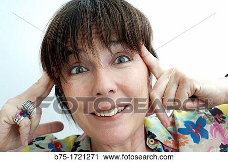 Stock Image - primer plano de cara de mujer con expresion de sorpresa, closeup of female face with surprise,. Fotosearch