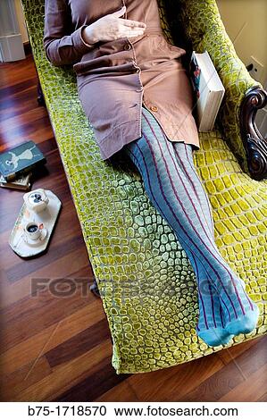 primer plano de mujer tumbada en una chaise longue relajada, close-up of woman lying on a chaise longue relaxed, View Large Photo Image Stock Image - primer plano de mujer tumbada en una chaise longue relajada, close-up of woman lying on a chaise longue relaxed,. Fotosearch