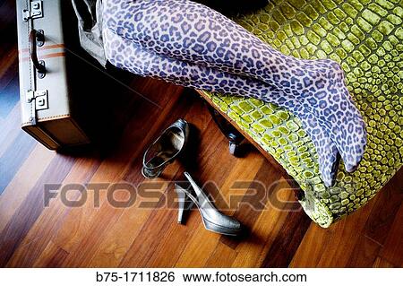 primer plano de piernas de mujer tumbada en una chaise longue con zapatos de tacon y maleta, close up of woman legs lying on a chaise longue with heel shoes and suitcase, View Large Photo Image Stock Photograph - primer plano de piernas de mujer tumbada en una chaise longue con zapatos de tacon y maleta, close up of woman legs lying on a chaise longue with heel shoes and suitcase,. Fotosearch