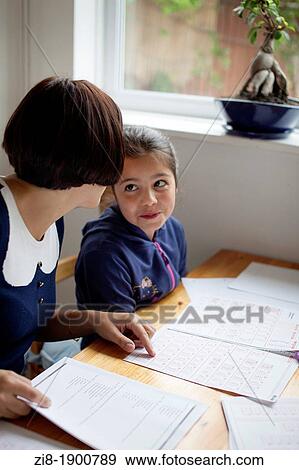 Stock Photo - Private tuition-Schoolgirl learning for 11+ exams. Fotosearch