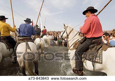 Procession during annual gipsy pilgrimage at Saintes-Maries-de-la-Mer, Camargue, France View Large Photo Image Stock Image - Procession during annual gipsy pilgrimage at Saintes-Maries-de-la-Mer, Camargue, France. Fotosearch
